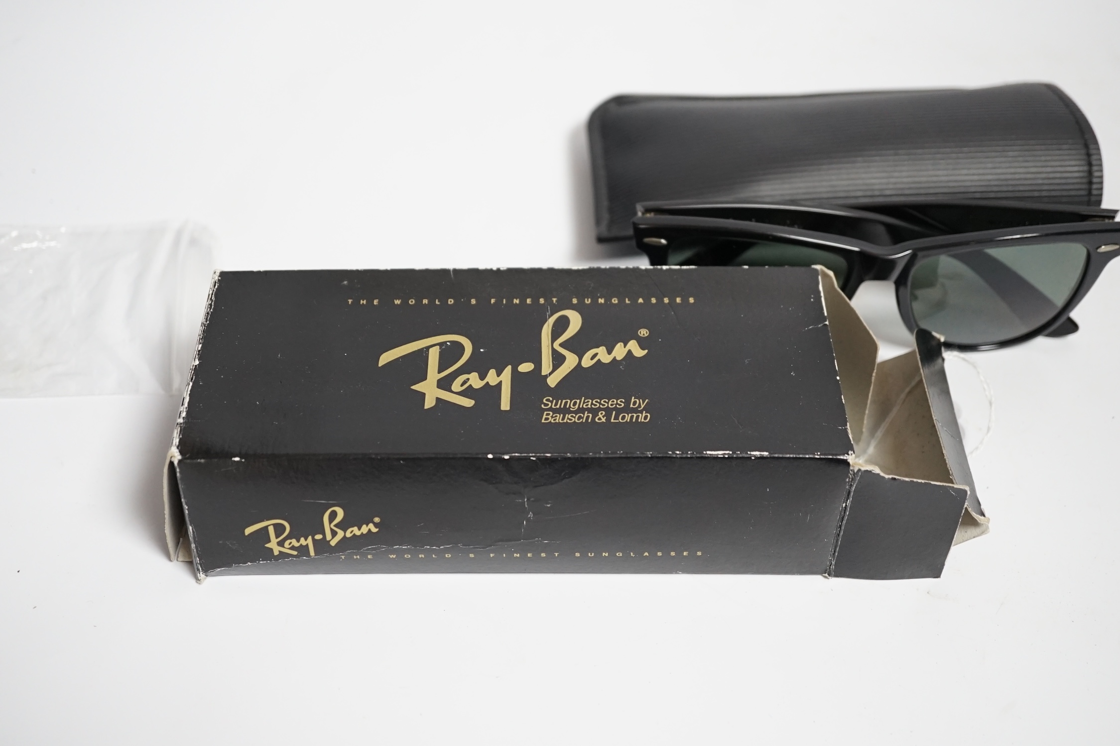 A pair of vintage Ray Ban Wayfarer sunglasses, with case and box, virtually unused.